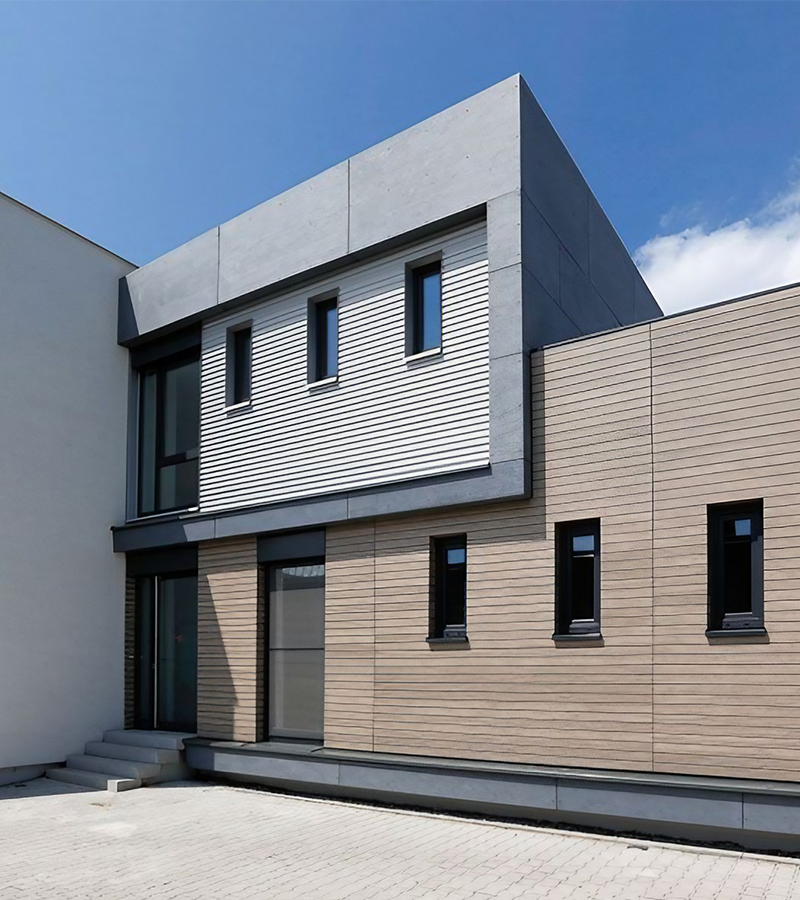Ein modernes Containergebäude aus Holz fotografiert von außen